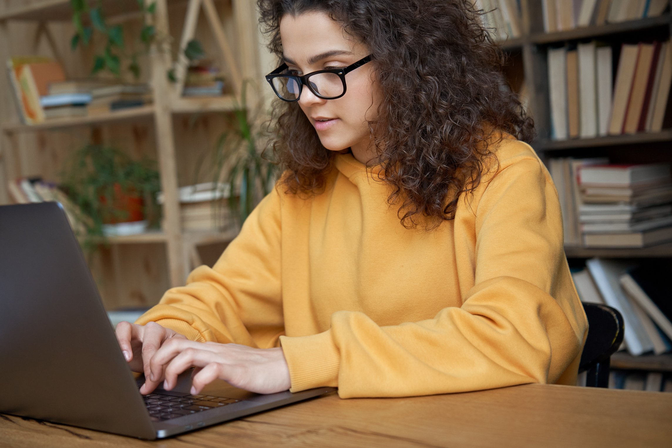 Person Working on Laptop at the Library